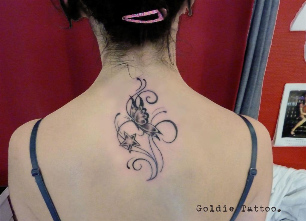 goldie-tattoo-papillon-etoile-nuque-19-05-2012-large.jpg