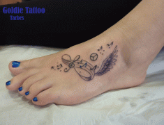 Goldie-Tattoo-Tarbes.12.2015.web.cle-de-sol-et-aile-sur-pied.jpg